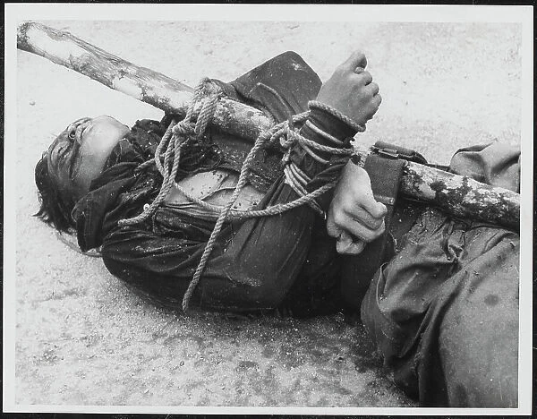 Body of a Malayan Terrorist trussed to a stake