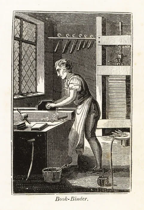 Framed Print : Book-binder planing a book block in a bindery Framed Print : Book-binder planing a book block in a bindery