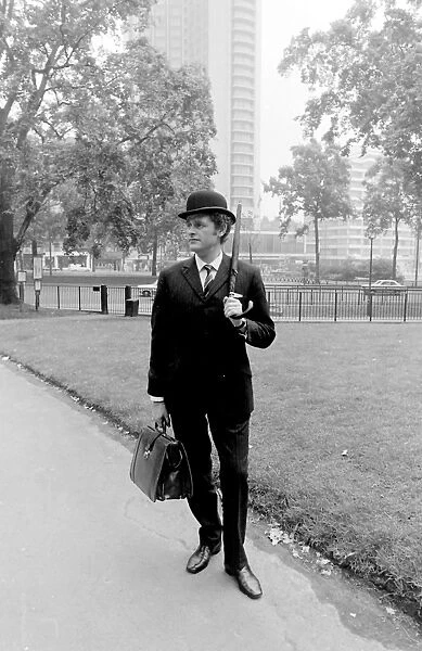 Bowler-hatted City gent in a park