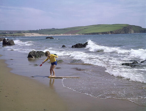 Boy on the beach at Bigbury Bay, Devon