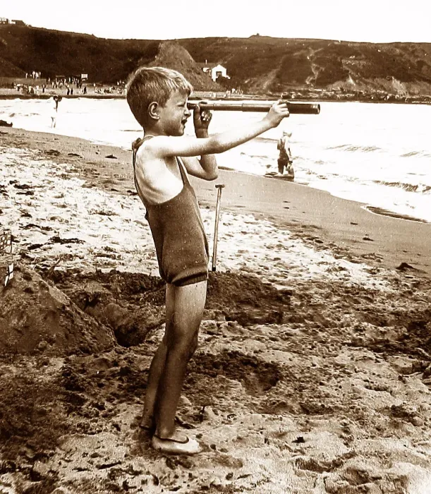 Framed Print : Boy on a beach with a telescope Framed Print : Boy on a beach with a telescope