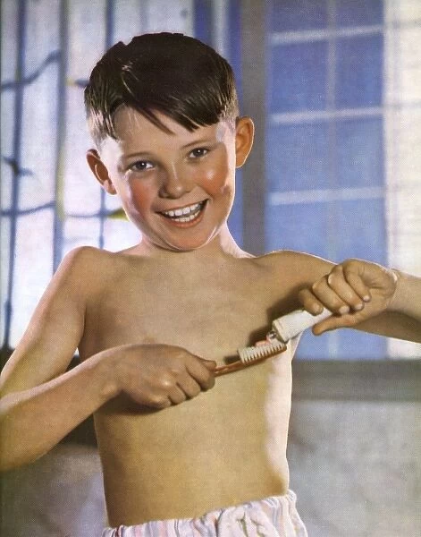 A boy cleaning his teeth