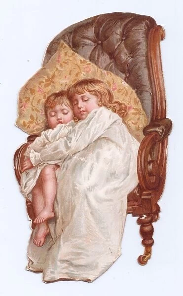 Boy and girl asleep on a chair-shaped greetings card