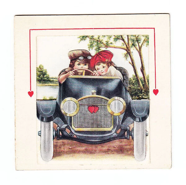 Boy and girl in a car on a romantic greetings card