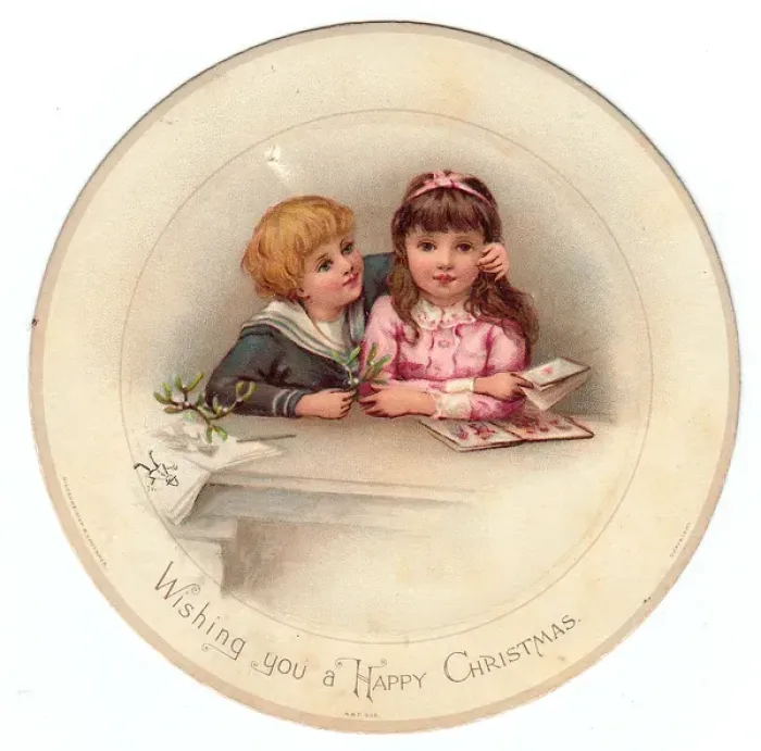 Framed Print : Boy and girl with mistletoe on a circular Christmas card Framed Print : Boy and girl with mistletoe on a circular Christmas card