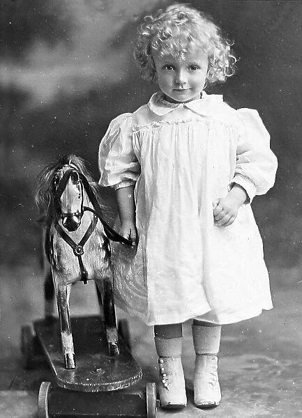Boy or girl with toy horse Studio photo Victorian period