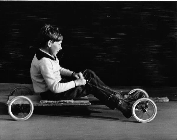 Boy on a home-made go-kart