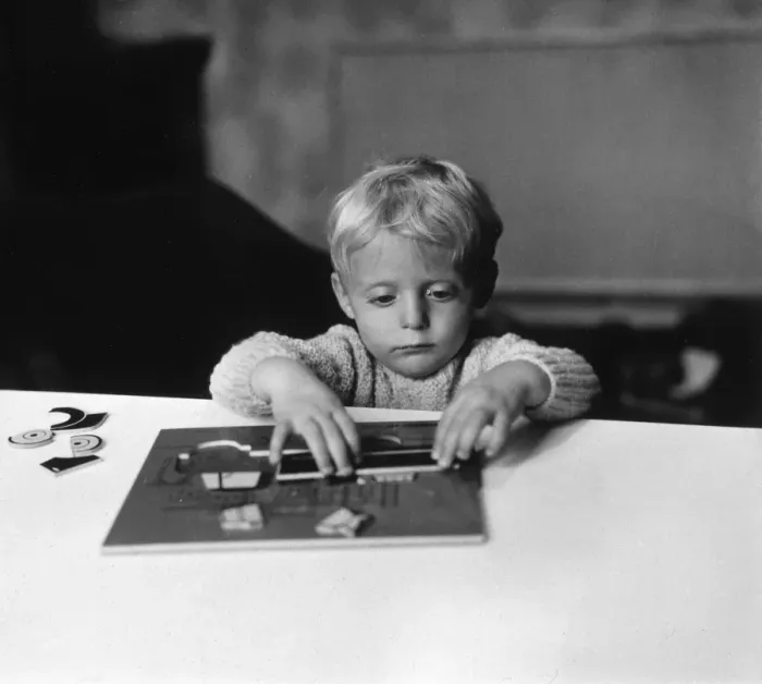Framed Print : Boy Playing with Puzzle Framed Print : Boy Playing with Puzzle