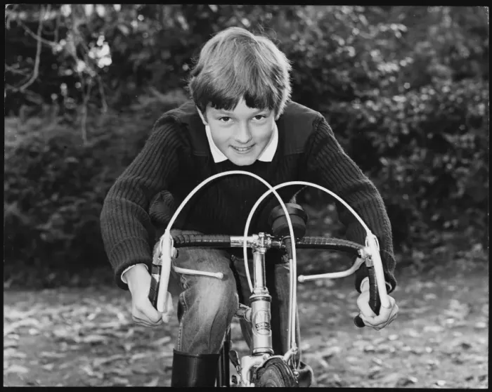 Framed Print : BOY RACER. A smiling boy leaning on the handlebars of his racing bike Framed Print : BOY RACER. A smiling boy leaning on the handlebars of his racing bike