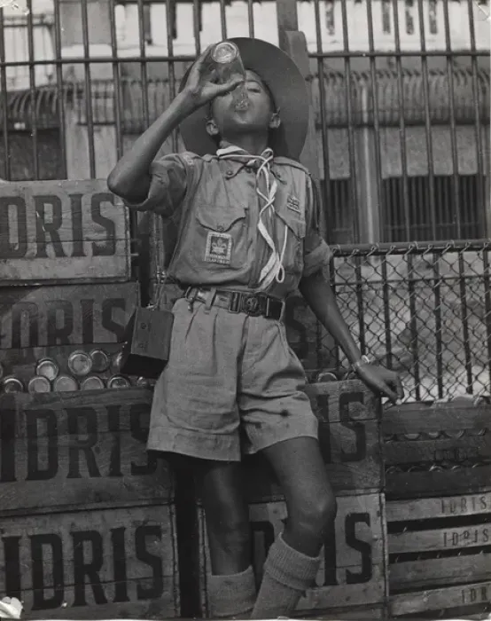 Framed Print : Boy scout drinking from a bottle of Idris, Mauritius Framed Print : Boy scout drinking from a bottle of Idris, Mauritius