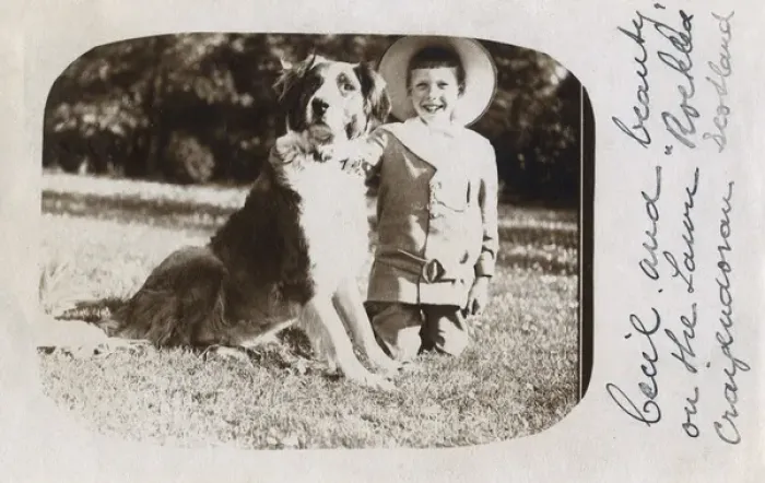 Framed Print : Boy in straw hat with large dog