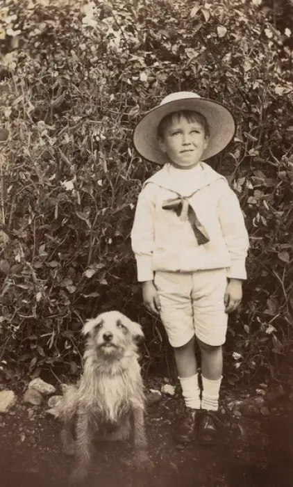 Framed Print : Boy with a terrier dog in a garden Framed Print : Boy with a terrier dog in a garden