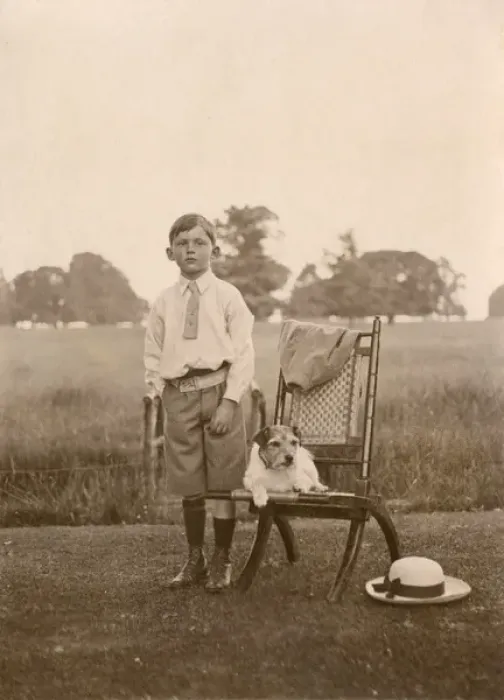 Framed Print : Boy with a terrier dog in a garden Framed Print : Boy with a terrier dog in a garden