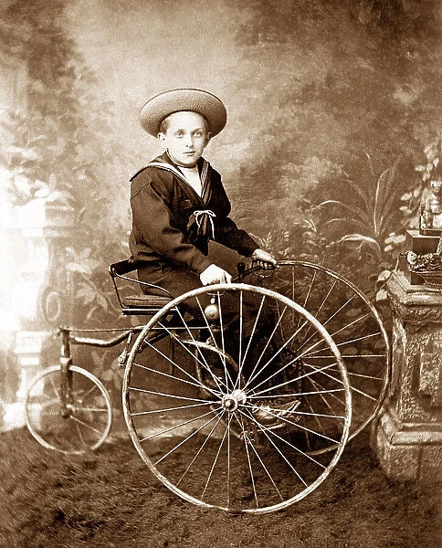 Boy on tricycle portrait