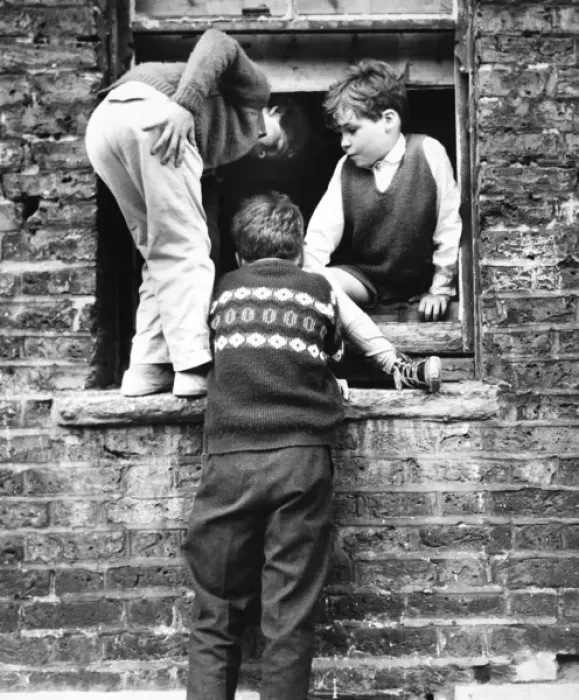 Framed Print : Boys at a boarded up window, Balham, SW London Framed Print : Boys at a boarded up window, Balham, SW London
