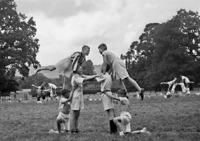Framed Print : Boys doing acrobatics in a field Framed Print : Boys doing acrobatics in a field