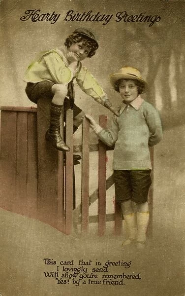 Two boys at a garden gate on a birthday postcard