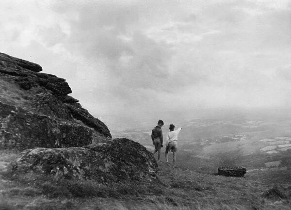 Two boys on Hound Tor, Dartmoor, Devon