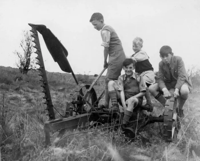 Framed Print : Four boys playing on farming equipment Framed Print : Four boys playing on farming equipment