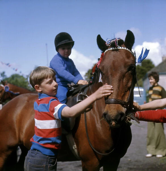 Boys with a pony at a street party