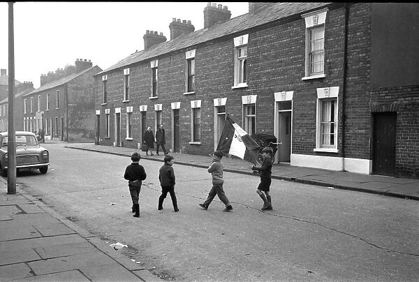Boys in a street with a flag, Belfast, Northern Ireland