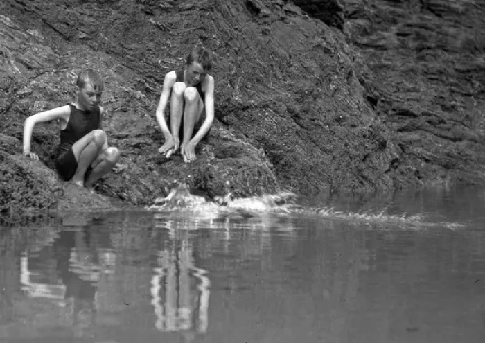 Framed Print : Two boys in swimsuits sitting on a rock Framed Print : Two boys in swimsuits sitting on a rock
