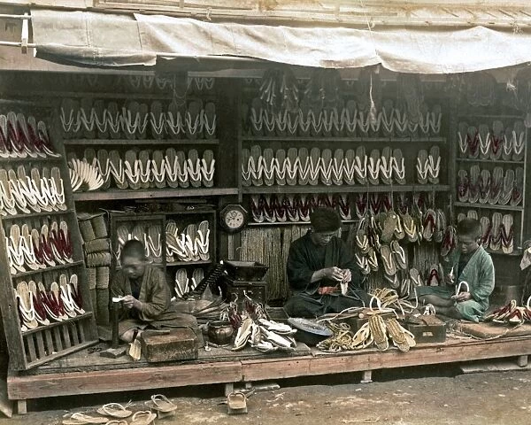 Boys working at a sandal store, Japan