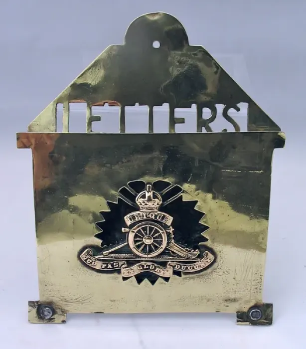 Framed Print : Brass letter rack with badge of the Royal Artillery Framed Print : Brass letter rack with badge of the Royal Artillery