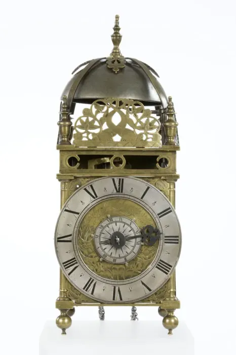 Framed Print : Clock. Brass and metal lantern clock on four ball feet Framed Print : Clock. Brass and metal lantern clock on four ball feet