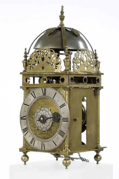 Framed Print : Clock. Brass and metal lantern clock on four ball feet Framed Print : Clock. Brass and metal lantern clock on four ball feet