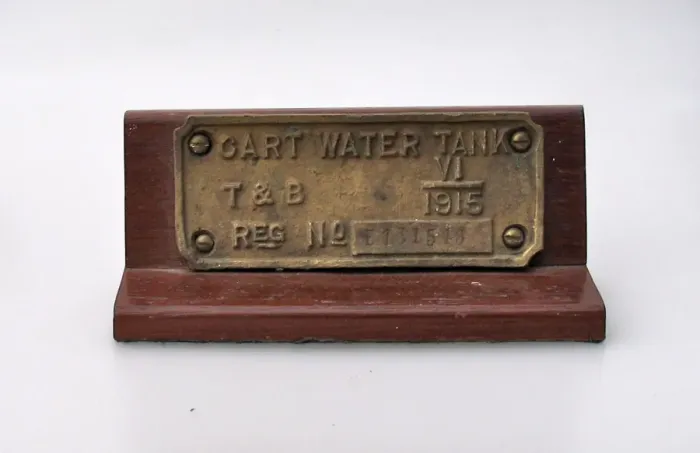 Framed Print : Brass plate, on a wooden plinth- CART WATER TANK Framed Print : Brass plate, on a wooden plinth- CART WATER TANK