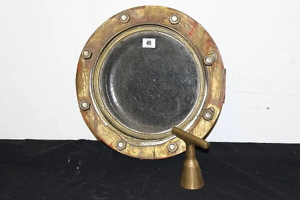 Brass porthole reputed to be from RMS Mauretania