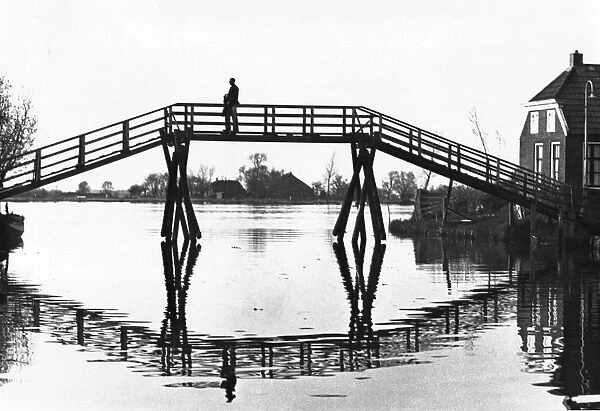 Bridge in silhouette over a stretch of water