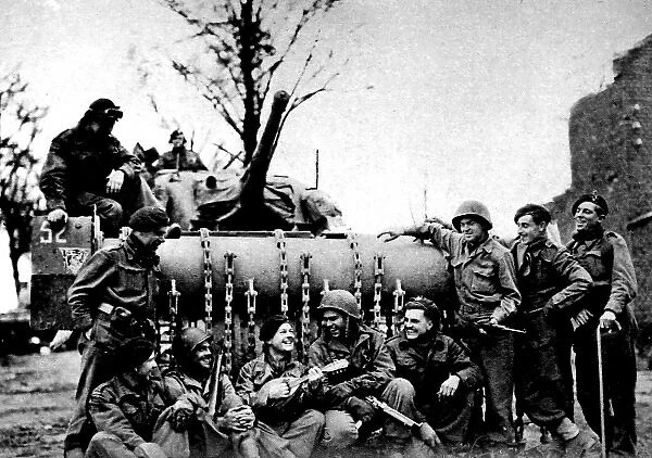 British and American troops singing beside a Sherman Flail T