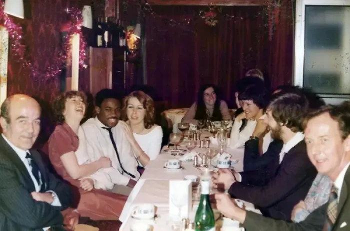 Framed Print : British Caribbean man at a Christmas office dinner party