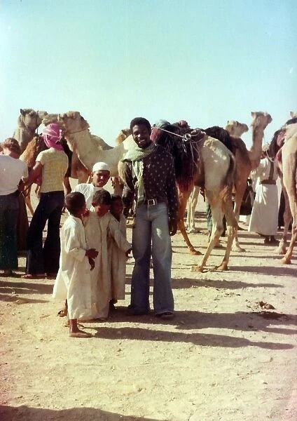 British Caribbean man with Omani children in Oman