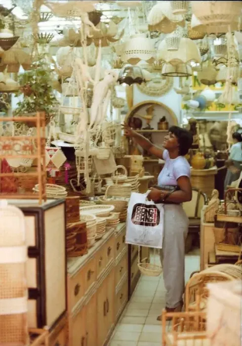 Framed Print : British Caribbean woman points to an item, novelty shop, Hon Framed Print : British Caribbean woman points to an item, novelty shop, Hon
