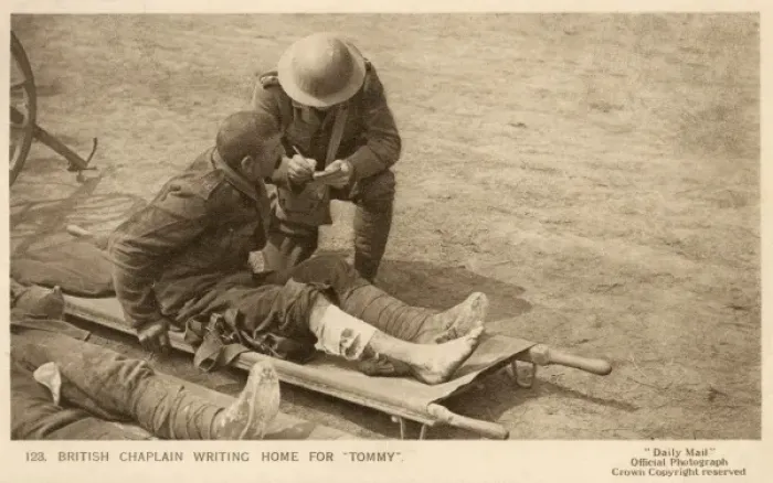Framed Print : British Chaplain writes for a wounded soldier Framed Print : British Chaplain writes for a wounded soldier