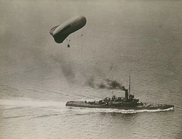 A British destroyer towing an observation balloon