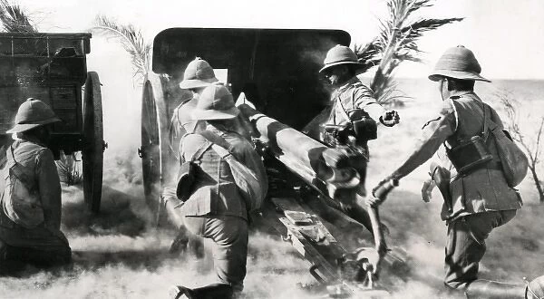 British gunners firing captured gun in the desert, WW1