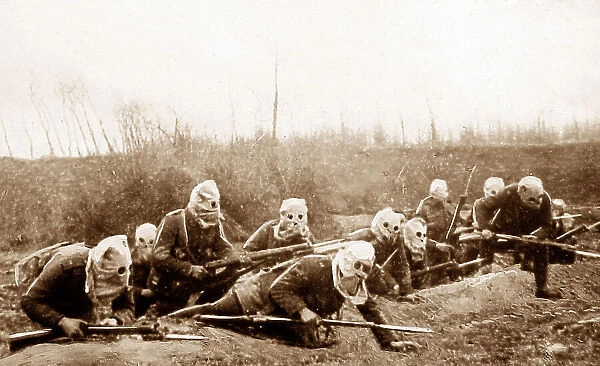 British Infantry advancing wearing gas helmets during WW1