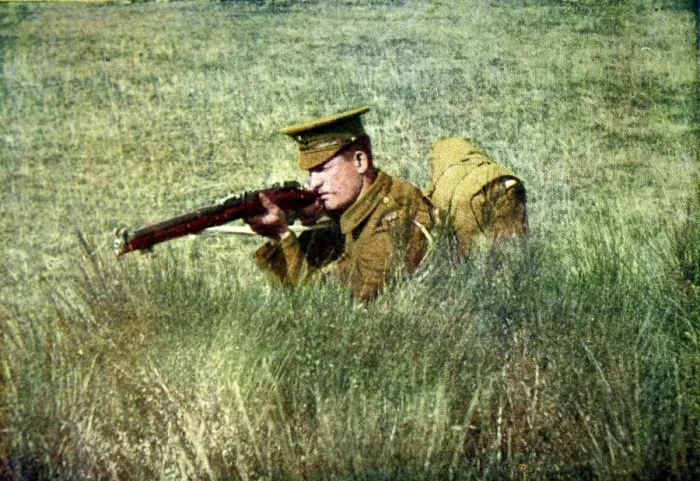 Framed Print : A British infantryman kneeling behind cover Framed Print : A British infantryman kneeling behind cover