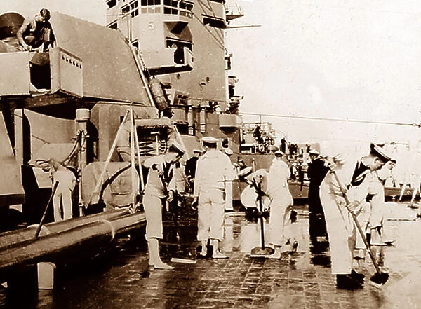 British Navy sailors swabbing the decks