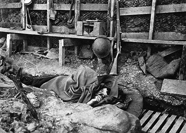 British soldier asleep in a trench