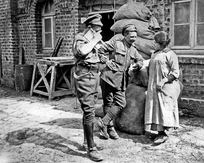 Framed Print : Two British soldiers chat with millers daughter, WW1 Framed Print : Two British soldiers chat with millers daughter, WW1