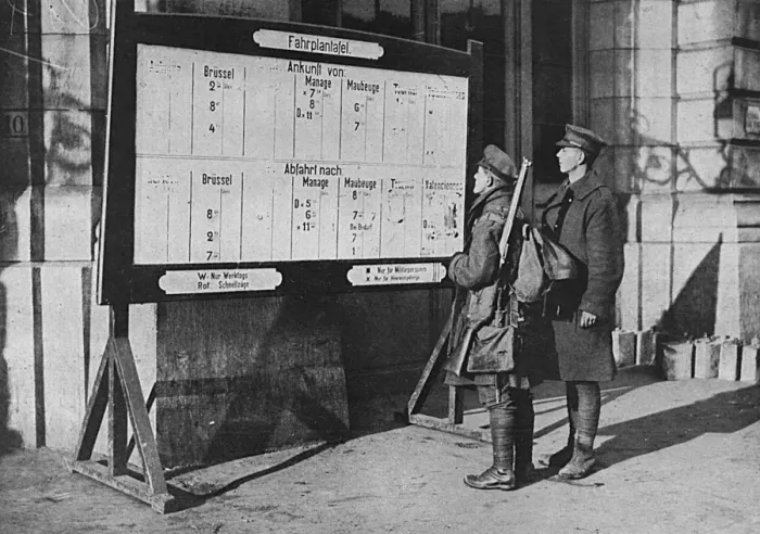 Framed Print : British soldiers looking at German timetable in Mons station Framed Print : British soldiers looking at German timetable in Mons station