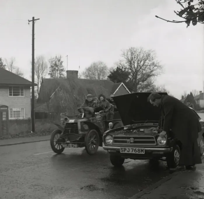 Framed Print : Broken down modern car overtaken by veteran model Framed Print : Broken down modern car overtaken by veteran model