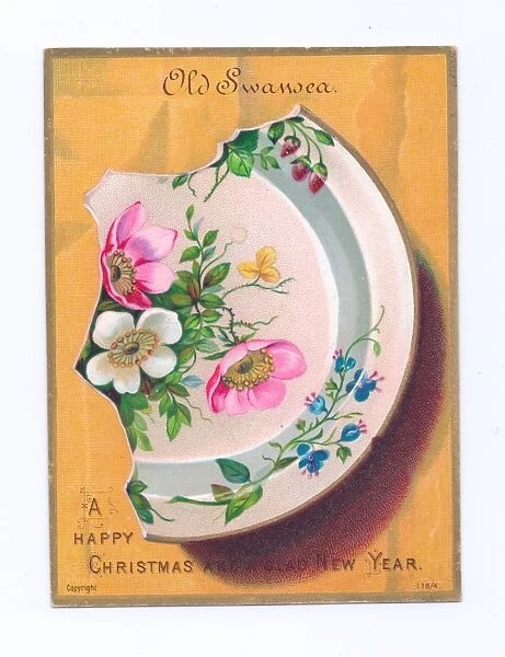 Broken Old Swansea china plate on a Christmas postcard