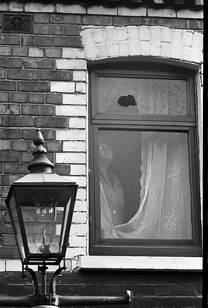 Broken window, Falls Road, Belfast, Northern Ireland