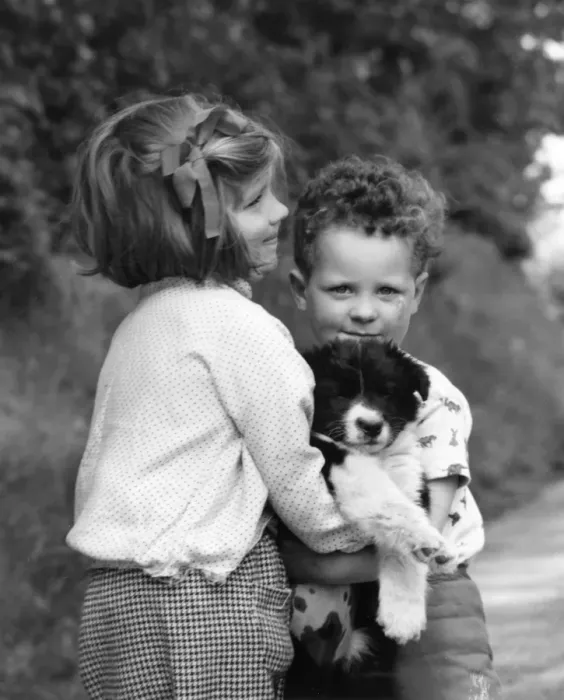 Framed Print : Brother and sister with new puppy Framed Print : Brother and sister with new puppy
